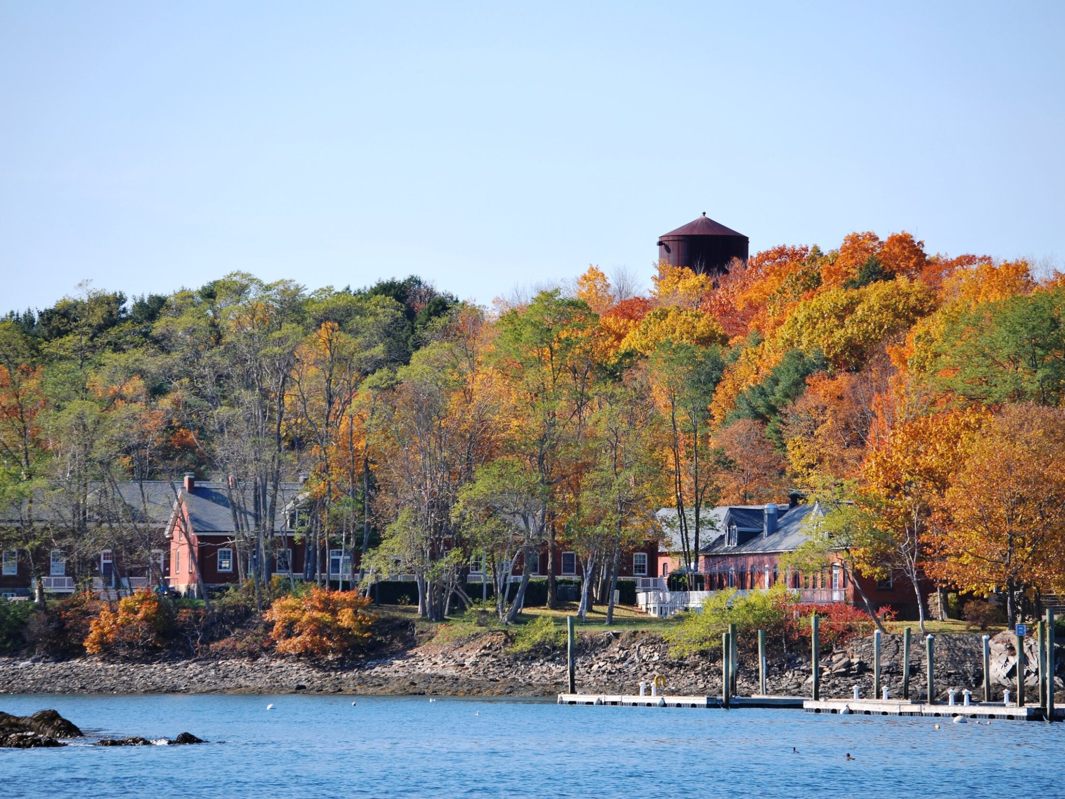 a body of water with a city in the background