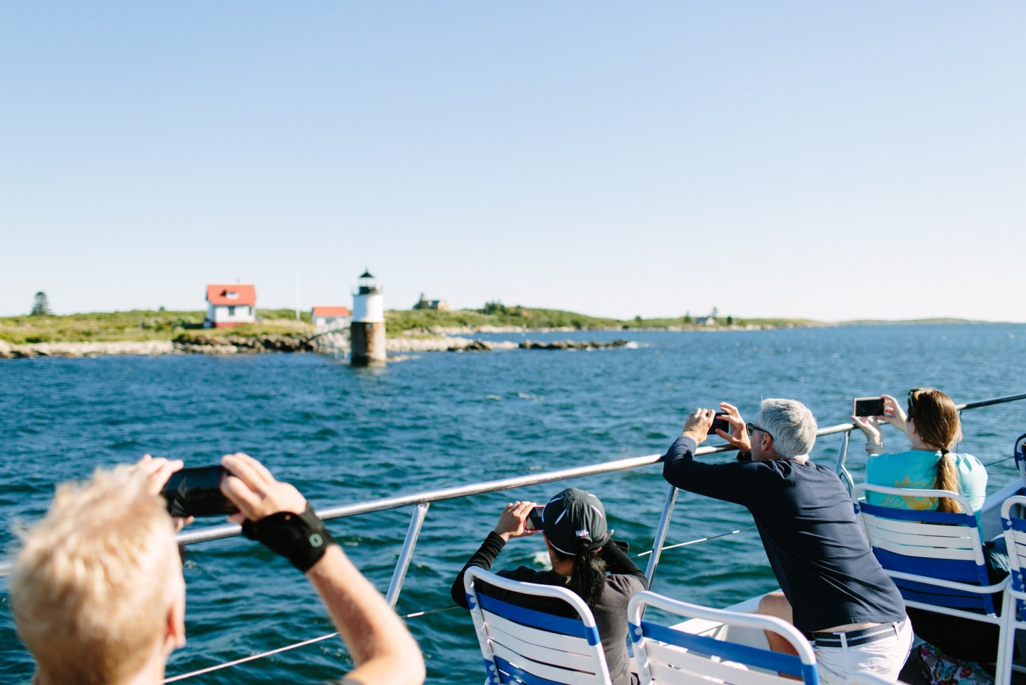 a group of people in a boat on a body of water