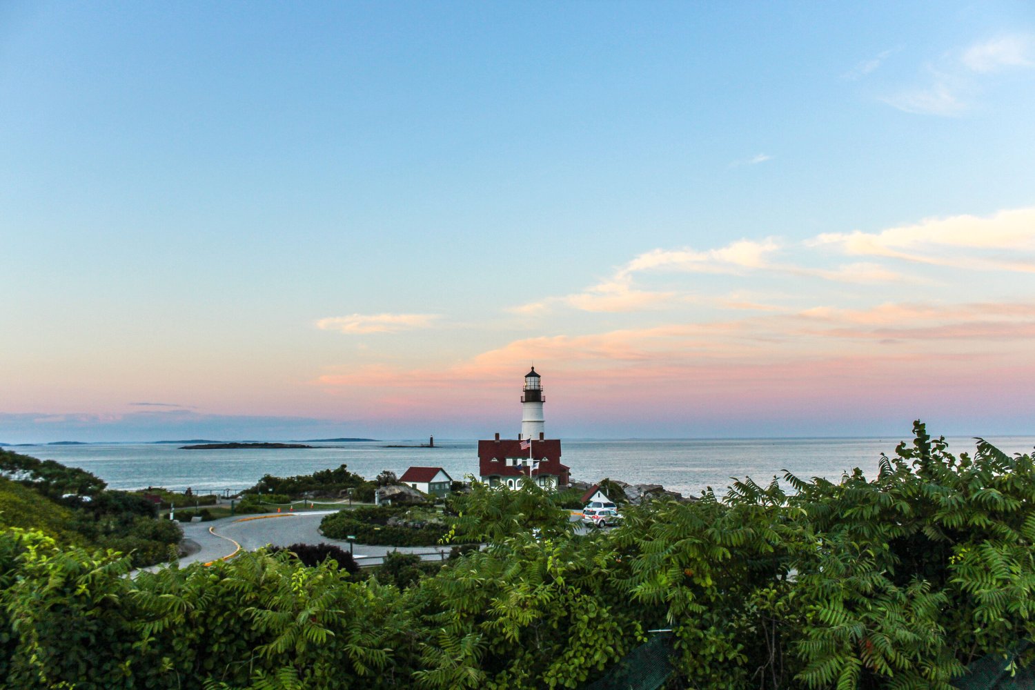 a group of people standing next to a body of water