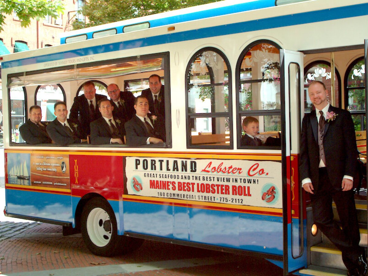 a person standing in front of a bus