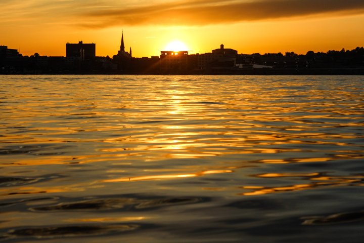 a sunset over a body of water