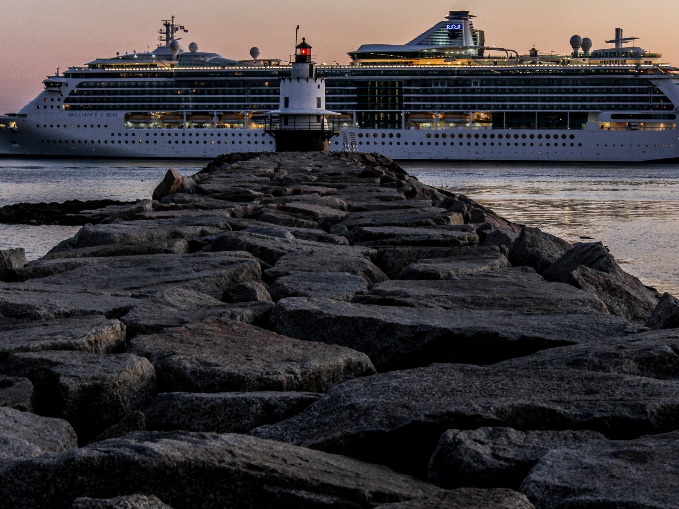 a boat that is sitting on a rock