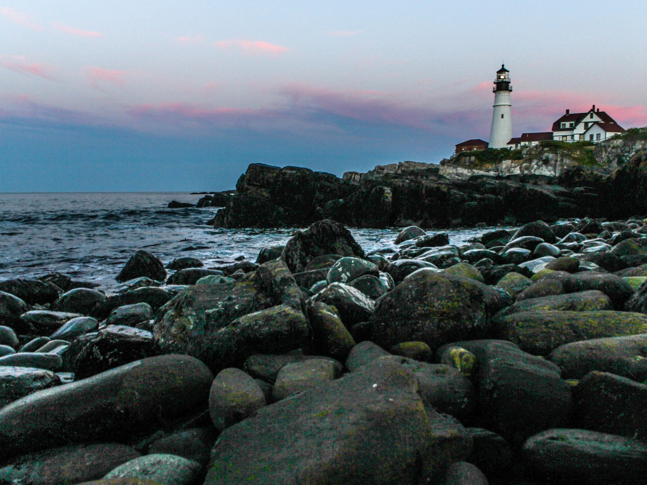 a rocky beach next to the ocean