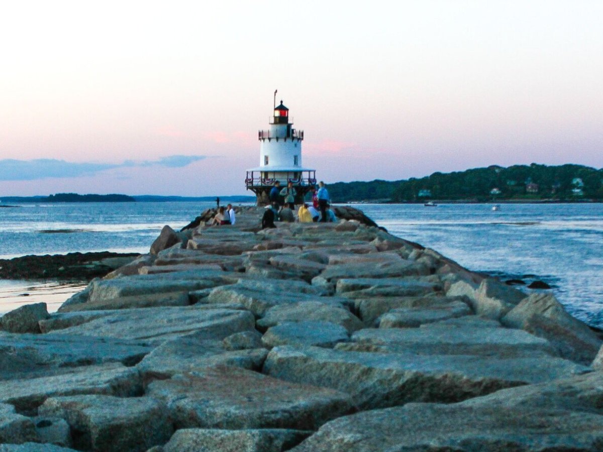 a rocky shore next to a body of water