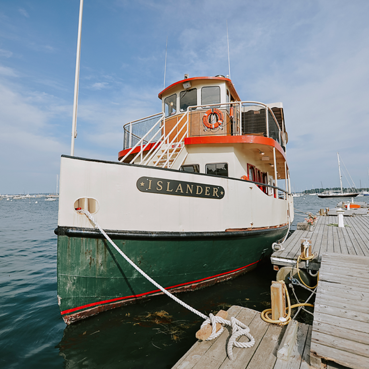 a boat is docked next to a body of water